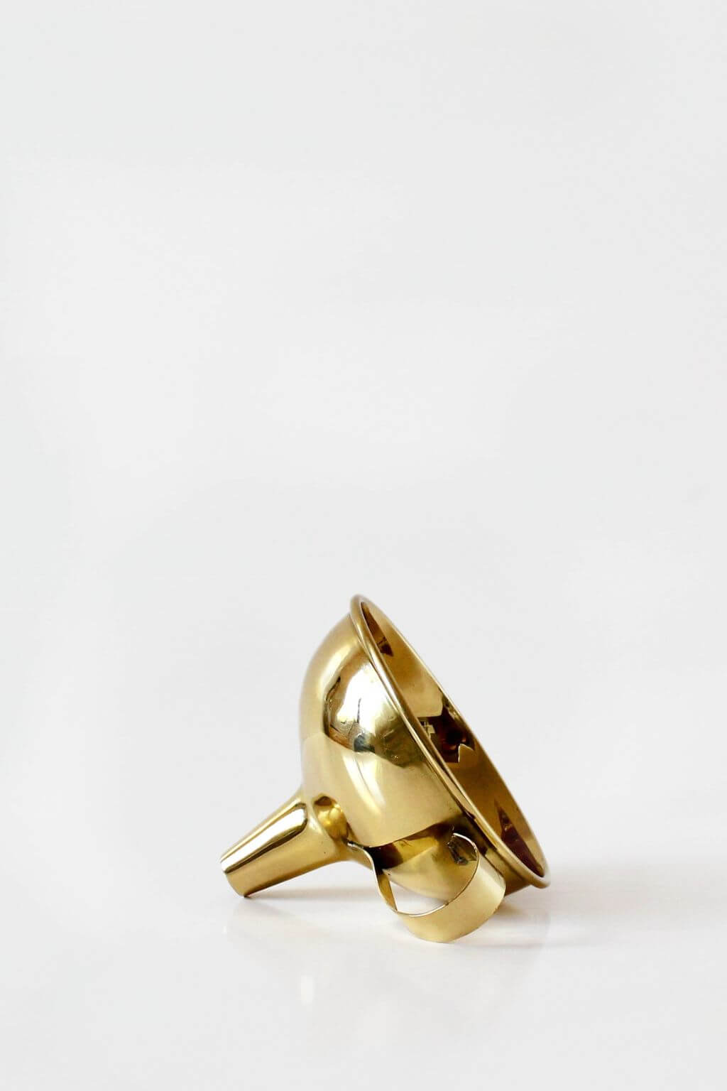 Gold funnel on a white background