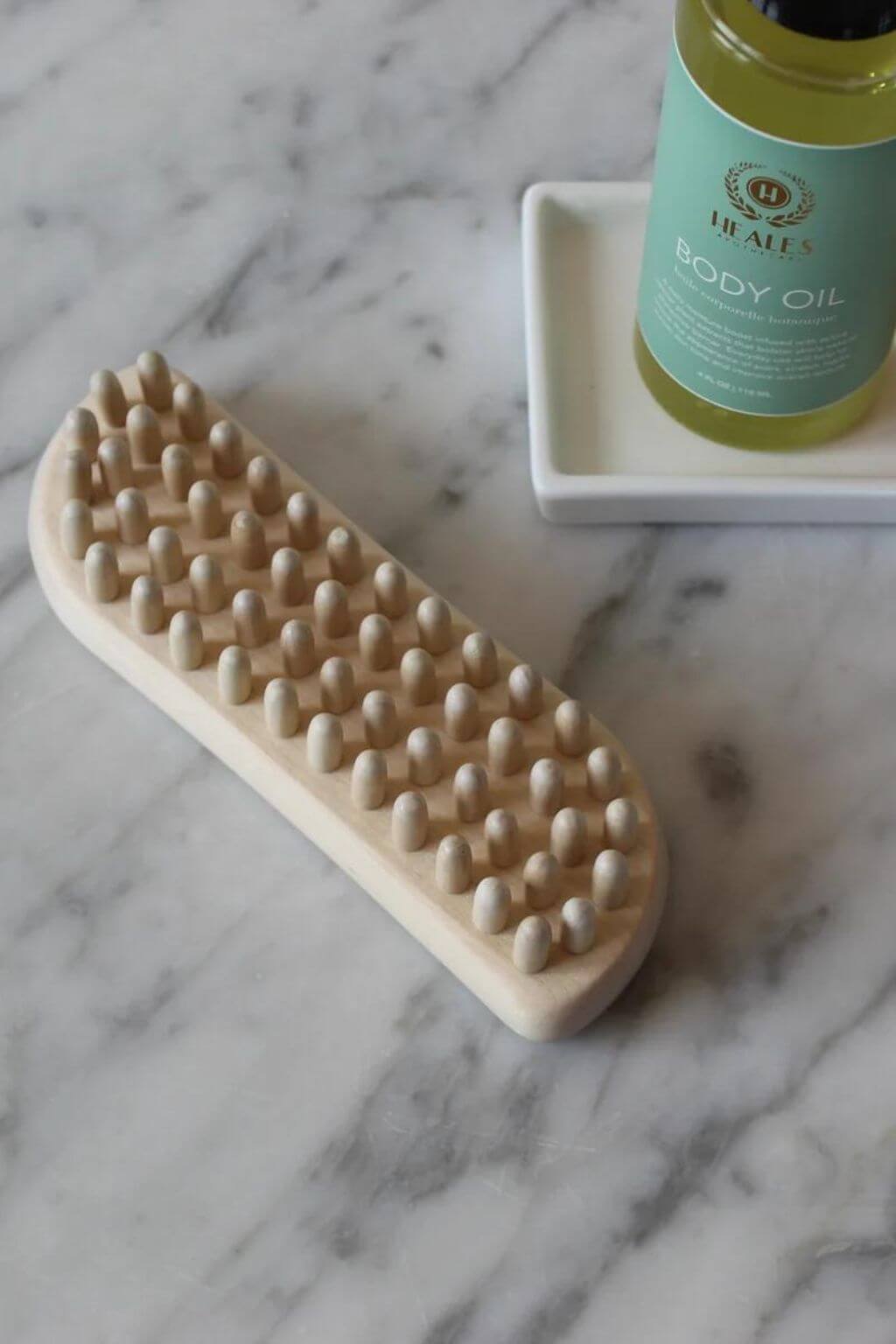 Wooden fascia massage tool used with body oil after bathing