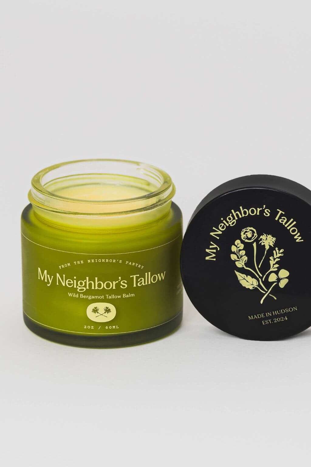 Wild bergamot tallow balm jar with lid open