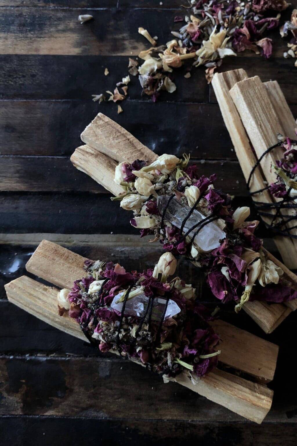 palo santo bundle with herbs and crystal wrap