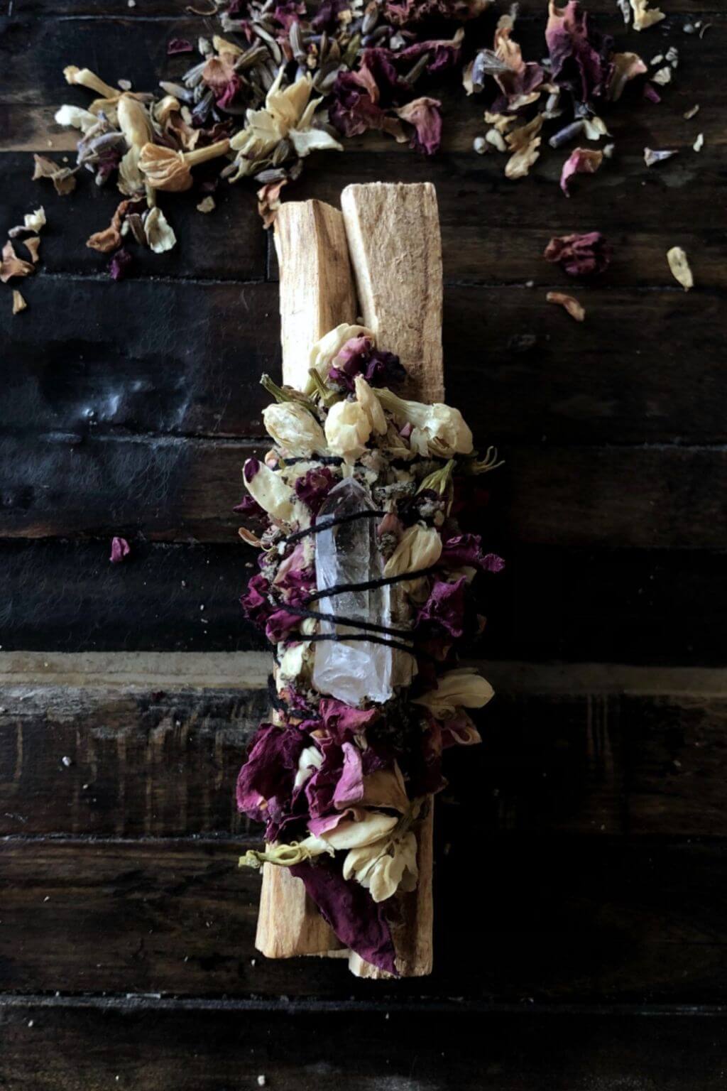 palo santo ritual bundle styled on rustic wood surface
