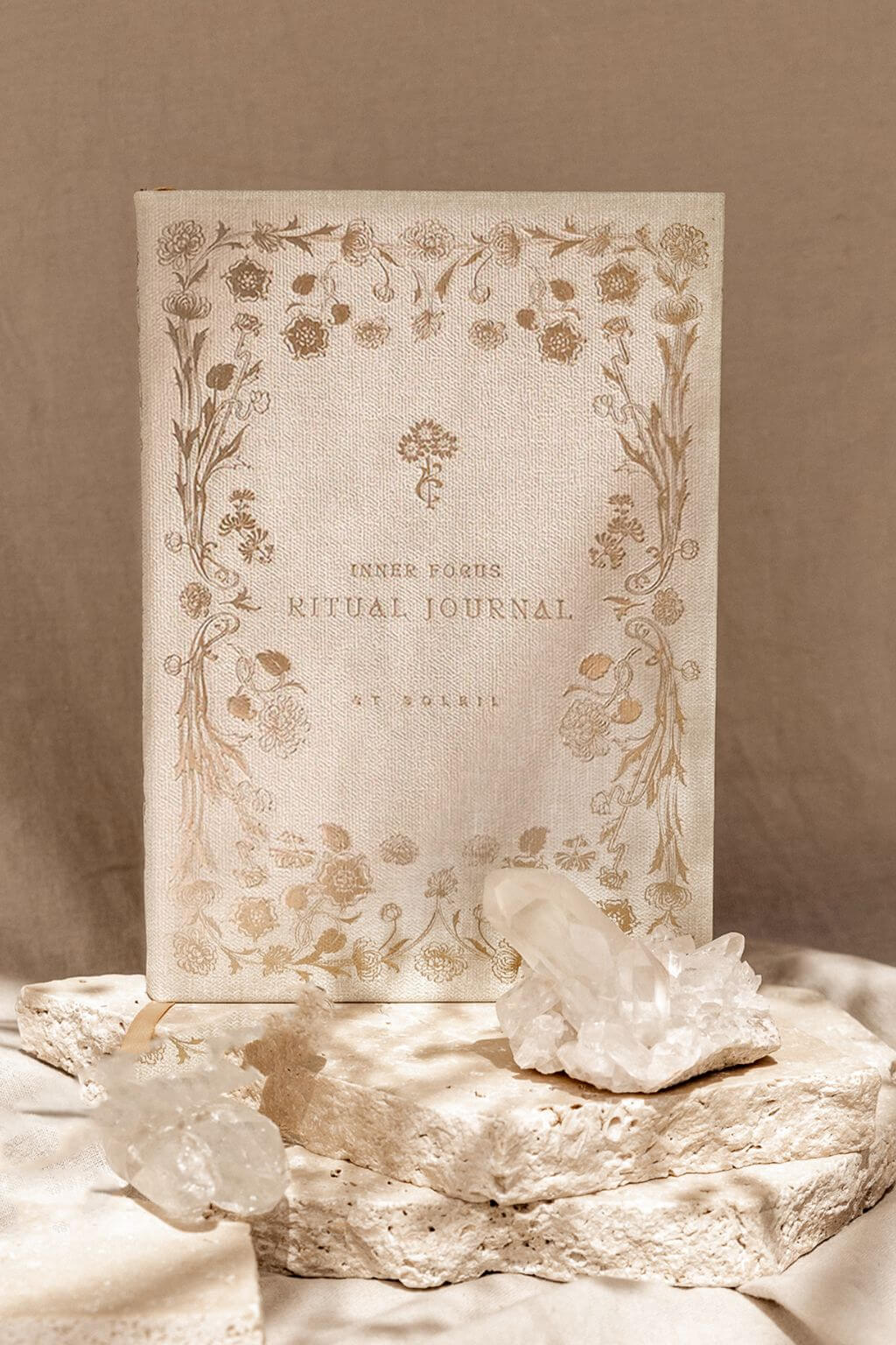 Decorative journal with floral design on a beige background