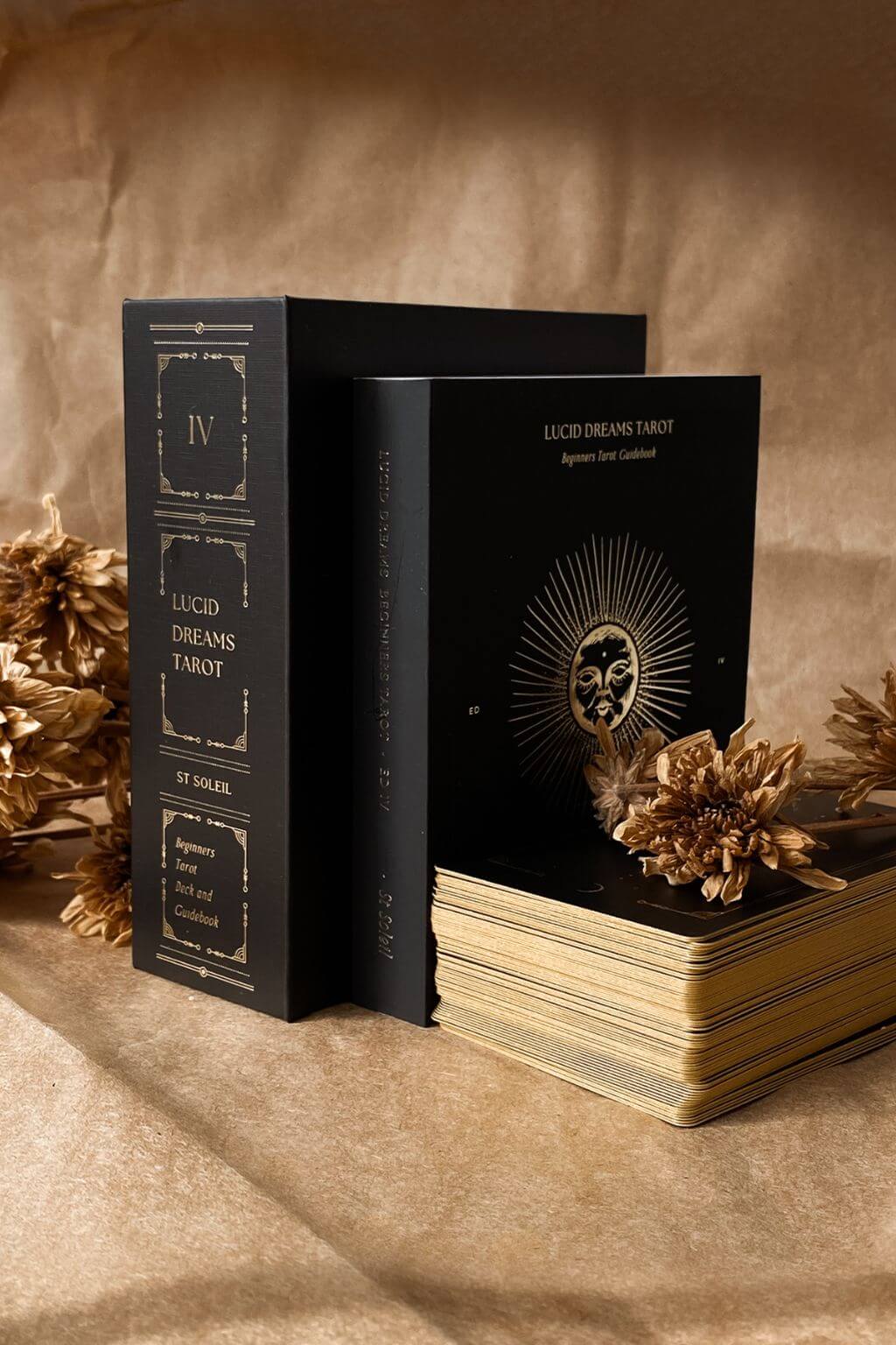 Black Lucid Dreams Tarot Gift Box with Guidebook and Tarot Cards against beige background
