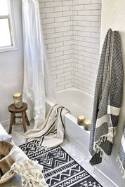 turkish towel hanging in bathroom black geometric pattern