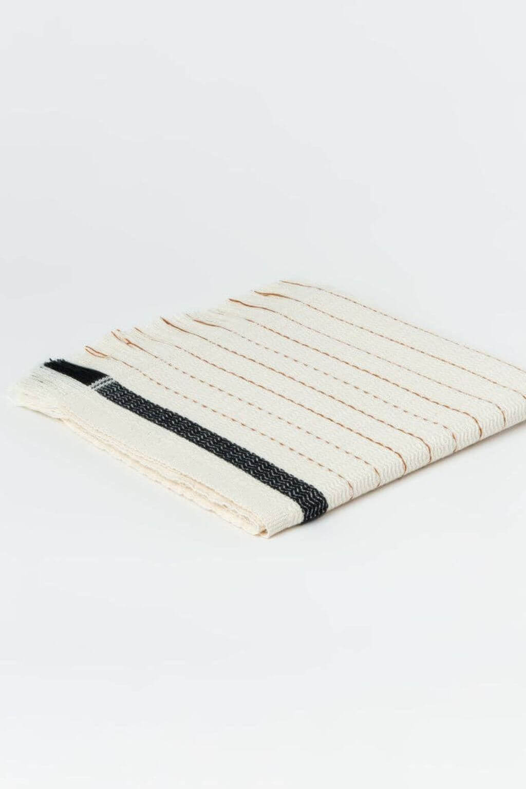 Textured woven hand towel with black stripe on a white background