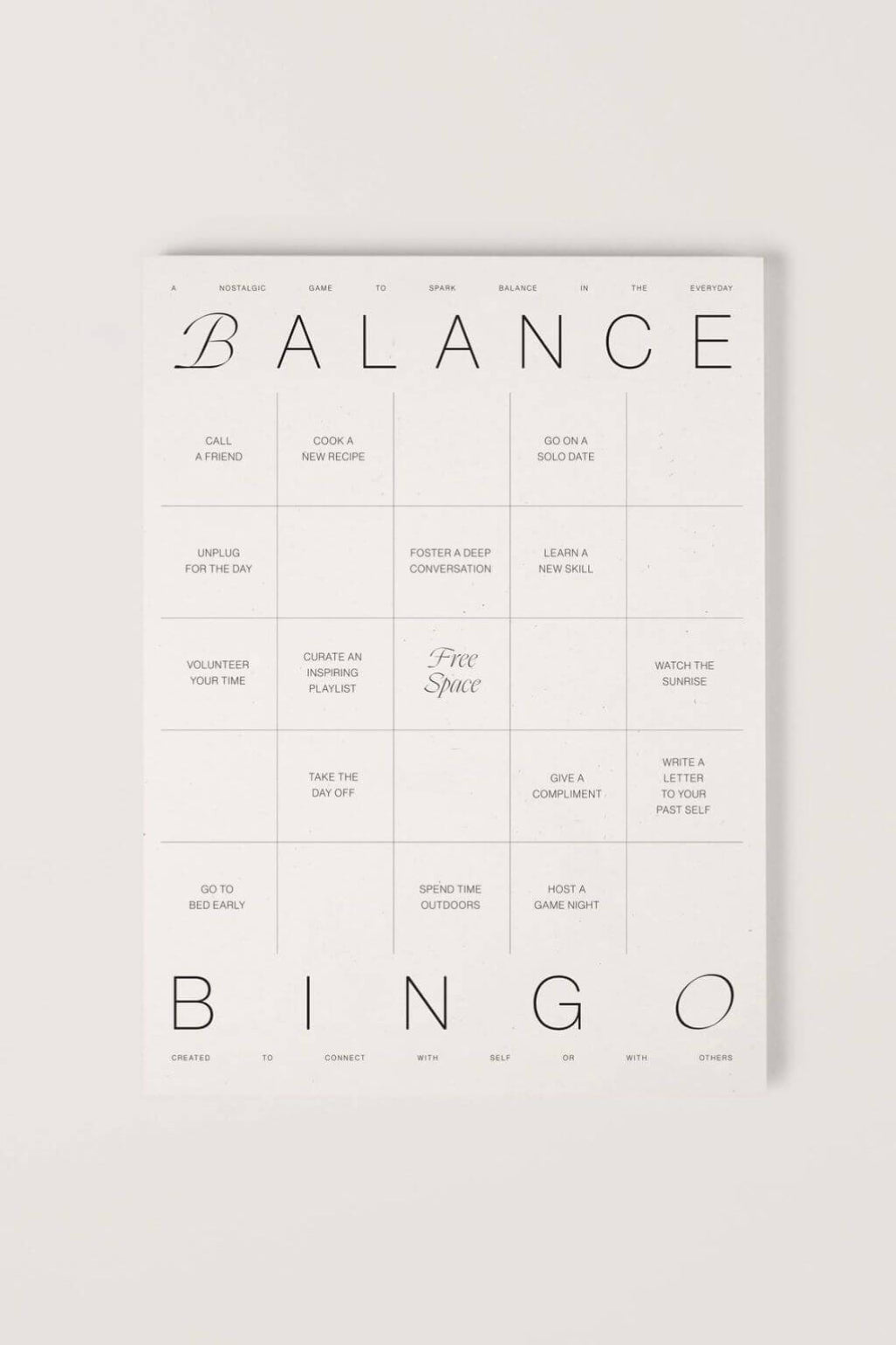 A minimalist balance bingo card with a clean white background and black text, featuring categories like 'BALANCE' and 'BINGO' with small daily prompts.