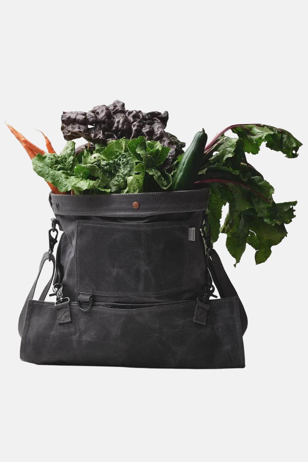 Foraging bag filled with freshly harvested vegetables