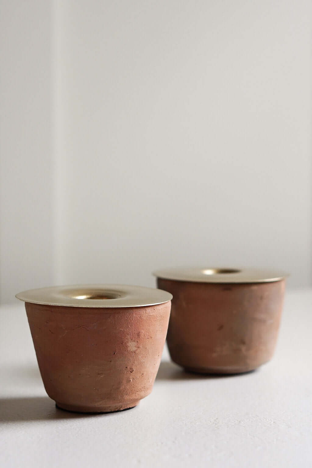 natural terracotta candle holder with removable brass insert
