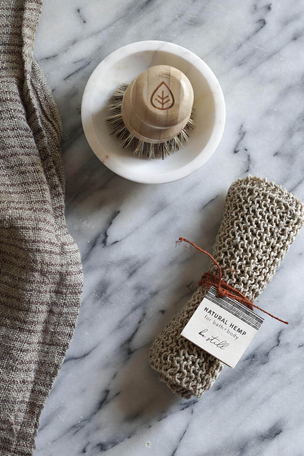 Hemp bath mitt with artisan label tied in string