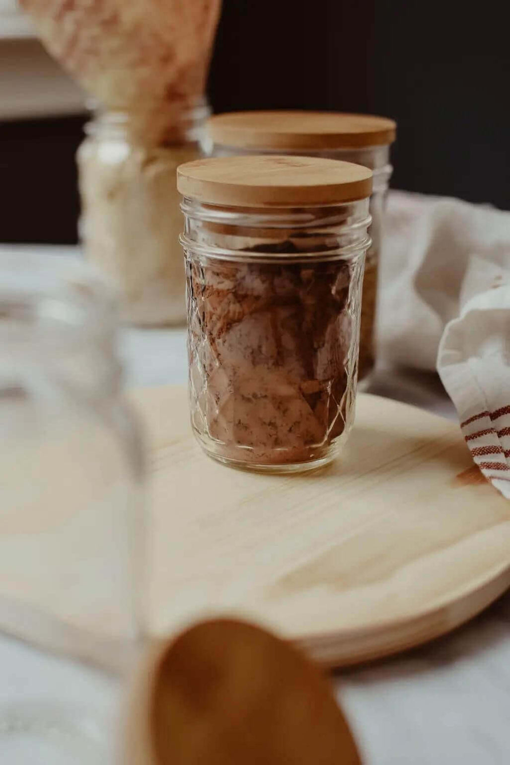Textured glass jar with circle bamboo lids on the top